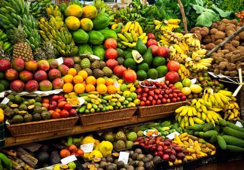Colourful fruit and vegetable market stall in a rustic display