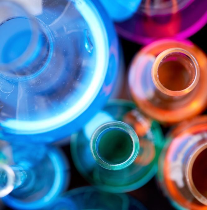 Above angle of several flasks with multi-color liquids